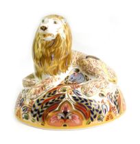 A Royal Crown Derby porcelain paperweight modelled as Lion, gold stopper and red printed marks, 14cm