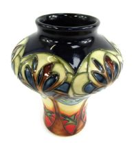 A Moorcroft Eventide Blue Dove vase, on a dark blue, red and cream ground, signed to underside and n