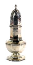 A George V silver sugar shaker, with acorn finial top and pierced design, with octagonal squat base,