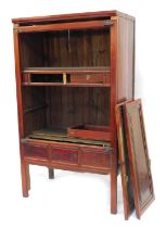 A Chinese hardwood cabinet, two doors and three false drawers, plated mounts, 185cm high, 109cm wide
