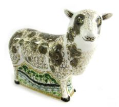 A Royal Crown Derby porcelain paperweight modelled as Jacob Sheep, gold stopper and red printed mark