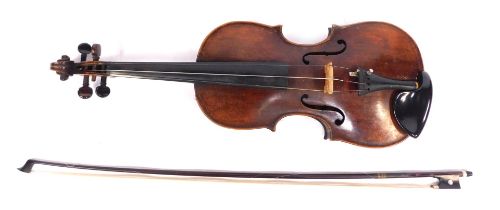 A late 19th/early 20thC violin, with single piece back, 58cm long, together with bow, cased.