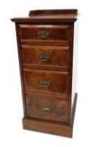 An Edwardian figured walnut pedestal chest, of four graduated drawers with heavy brass handles, with