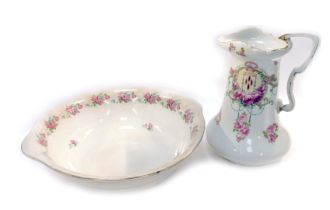 A 20thC wash jug and bowl set, on a cream ground with roses, in the Art Nouveau style, 40cm high.