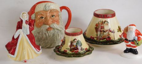 A group of Christmas related ceramics, to include a Royal Doulton figure from the Pretty Ladies coll