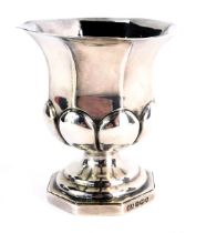A George V silver campana urn, on octagonal foot, maker HA, Sheffield 1927, 8cm high, 3.05oz.