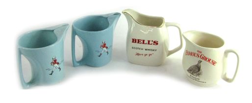 Breweriana, comprising a Famous Grouse water jug, Bell's water jug, and two further jugs. (4)
