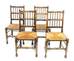 A set of four elm and beech Lancashire style chairs, with rush seats.