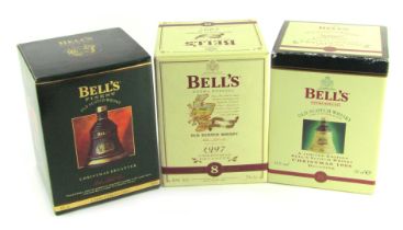 Three Bell's whisky Christmas decanters, for 1992, 1997 and 1998, boxed.