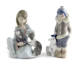 Two Lladro porcelain figures, modelled as a young girl seated holding kitten and dog, 15cm high, and