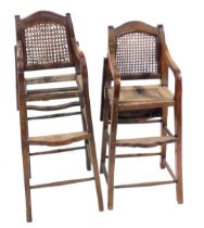 A pair of Oriental hardwood child's chairs, with tray table and rush back.