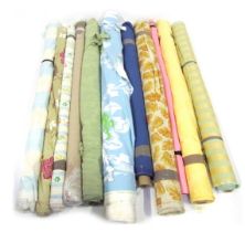 Various rolls of fabric, differing designs. (a quantity)