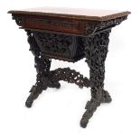 A late 19thC Anglo-Indian carved padouk wood writing and work table, fitted with a frieze drawer, ha