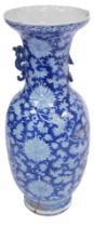 A 19thC Qing Dynasty blue and white porcelain vase, with dragon handles, decorated with flowers and