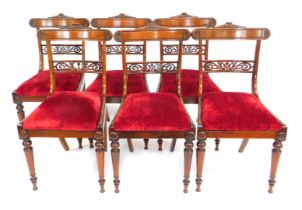 A set of six William IV rosewood dining chairs, with carved upper rails, fret cut horizontal rails,