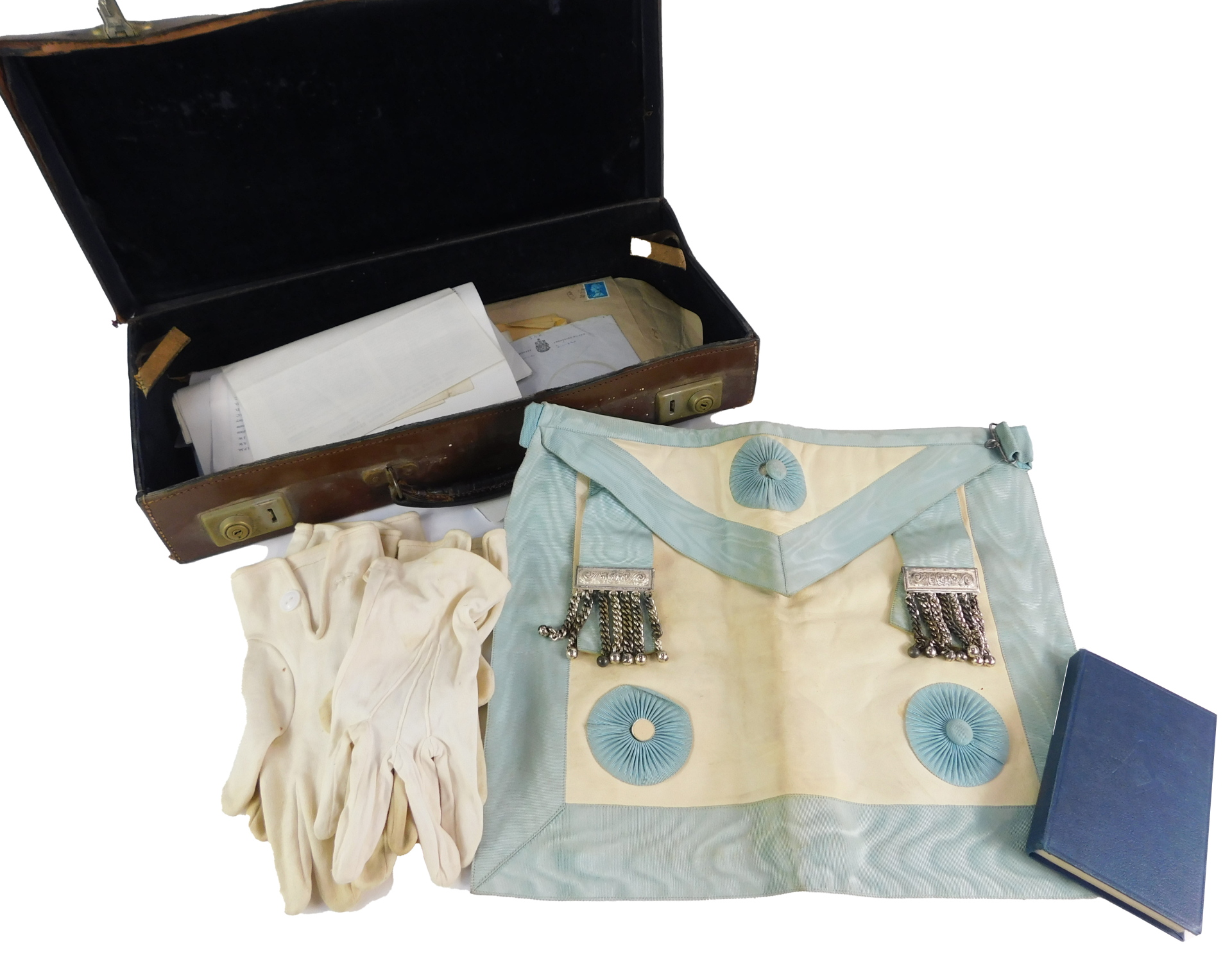 A leather case containing Masonic related items, aprons etc.
