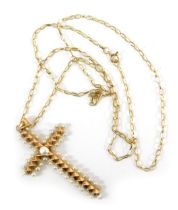 A 19thC French seed pearl cross, the cross 4cm high, on fine curb link neck chain, 48cm long, yellow