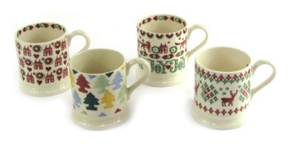 Four Emma Bridgewater pottery Christmas themed half pint mugs.