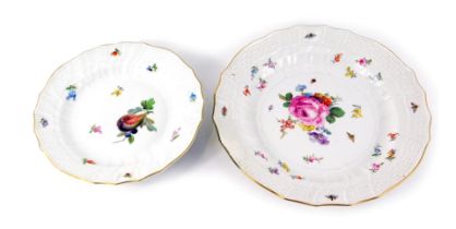 Two Meissen porcelain plates, painted centrally with flowers amongst beetles, printed marks, 24cm di