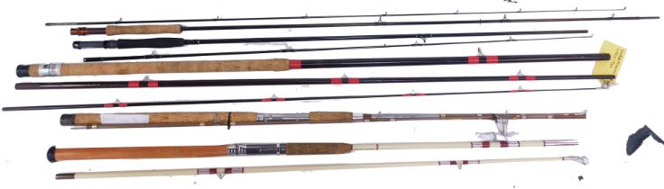 A group of fishing rods, comprising a Daiwa fibreglass rod, Shakespeare Super Dynamic spinning rod,