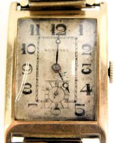 A Longines 9ct gold cased wristwatch head, of rectangular design, with a silvered coloured numeric f