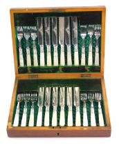 A late Victorian dessert knives and forks, comprising six pairs with engraved decorated and mother o