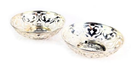 A pair of George V silver bonbon dishes, each with a pierced scroll border, Birmingham 1907, 2.82oz.