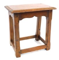 An oak rectangular joint stool, with slightly splayed chamfered square legs, on plain stretchers, 45