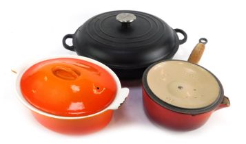 A Le Creuset cast iron two handled casserole dish and cover, 32cm diameter, together with a painted