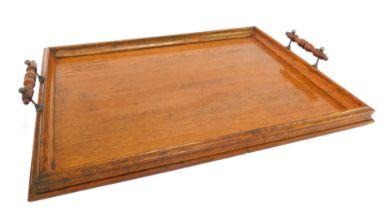 A 20thC oak two handled tray, with a gallery surround, 53cm wide.