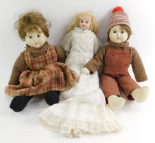 Three dolls, comprising a white face girl doll with blonde hair, turquoise type necklace, with artic