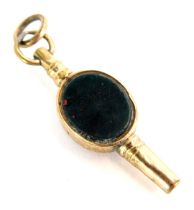 A 19thC watch key, set with agate and green bloodstone, in a yellow metal frame, unmarked but floral