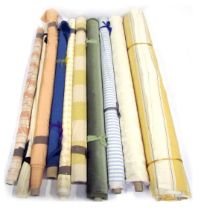 Various rolls of fabric, differing designs. (a quantity)