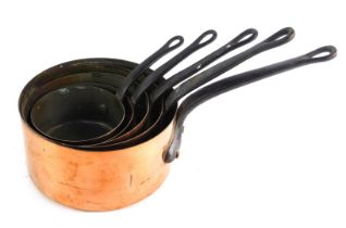 A set of five 20thC copper saucepans, each with cast handle, the largest 20cm diameter.