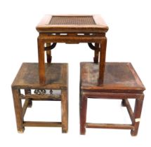 Three Chinese hardwood side tables, one with woven top, the other solid slats, with pierced design.