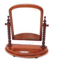 A Victorian mahogany framed toilet mirror, with arched central mirror supported by turned columns, o