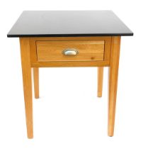 A modern oak square kitchen table, with black granite top, fitted drawer, on square tapered legs, 79