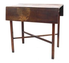 A George III mahogany Pembroke table, with two shallow fall leaves, fitted drawer, with cross frame,