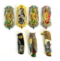 Seven Franklin Mint collectors knives, each in leather pouch.