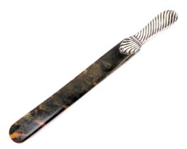 A Victorian silver handled page turner, the handle of heavy scroll decoration, London 1888, with tor