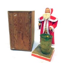 A Mid Century novelty automaton Father Christmas display figure, with case, 86cm high.