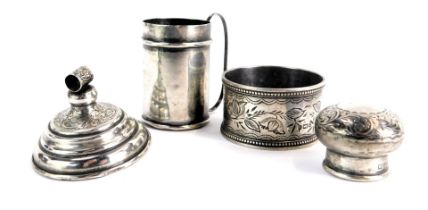 Assorted silver trinkets, comprising a miniature silver tankard, napkin ring, scent bottle lid, and