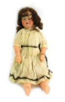 An early 20thC Armand Marseilles doll, in cream embellished dress, impressed marks to head Armand Ma