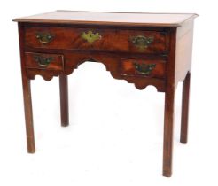 A George III mahogany low boy, with thumb moulded top and fitted with one long drawer with two short