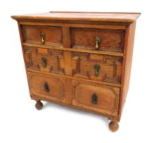 A17thC style oak chest of drawers, with two short and two long drawers, with brass drop handl