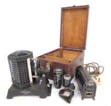 A Mid-20thC Filmasto slide projector, with accessories, in case.