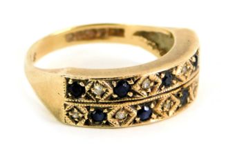 A half hoop dress ring, of two bar design, set with diamond and sapphire, yellow metal with rubbed h