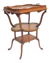 A mahogany two tier window table, the top inset with later oak tray, 78cm high, the top 60cm x 47cm.