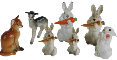 A collection of USSR and other animal ornaments, comprising lamb, five rabbits eating carrots, and a