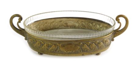 A WMF two handled serving dish, of oval form decorated with embossed flowers, cartouche and lower ba